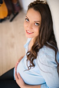 Young pregnant woman at home